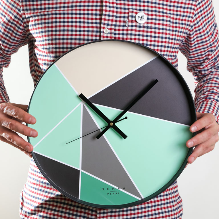 Beyond The Compass - large, modern wall clock, close up view from the hand