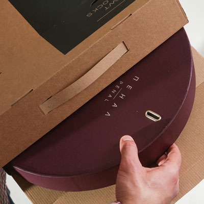 Funky wall clock in a stylish cardboard gift case