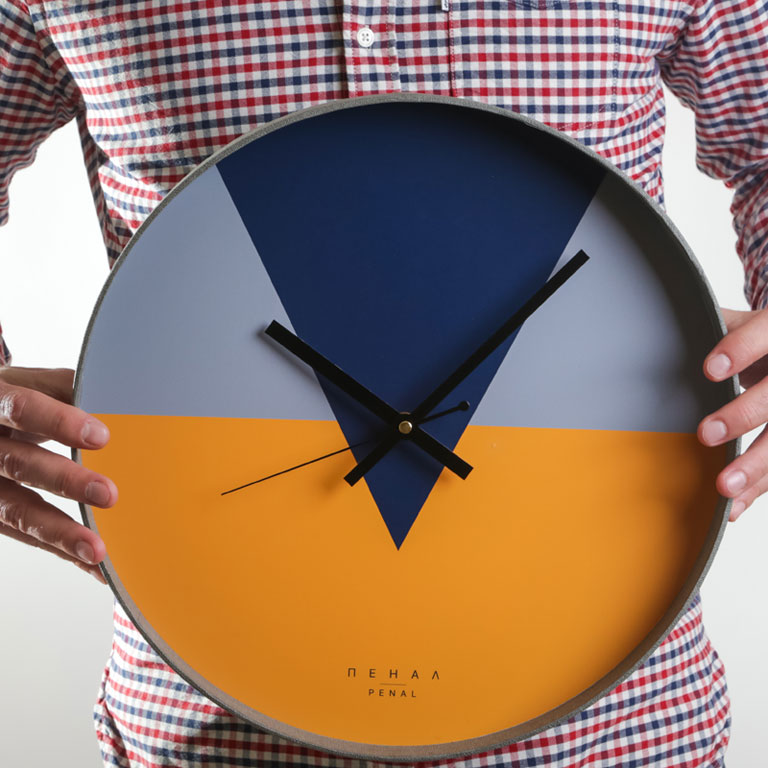 The Great Grey - large, modern wall clock, close up view from the hand